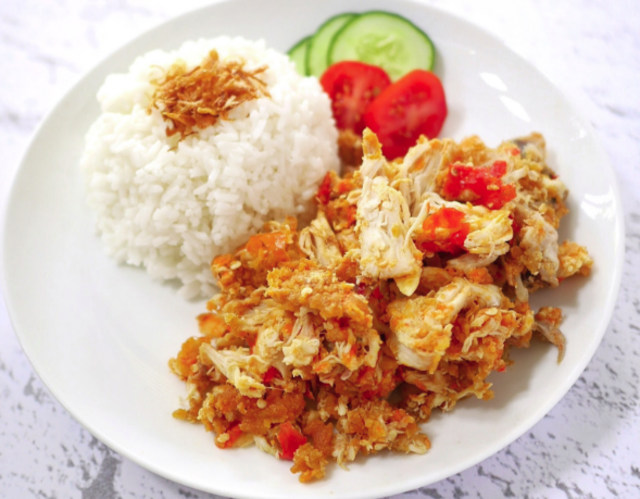 Ayam geprek with rice, tomatoes and cucumbers