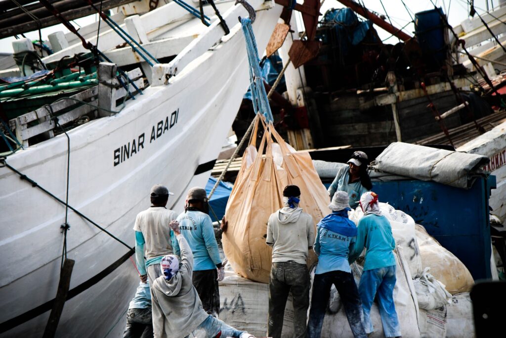 Fishermen carries their catch at Sunda Kelapa Harbour