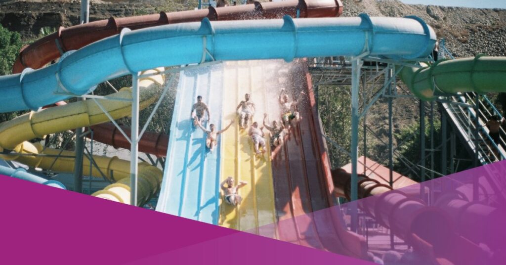 Group of men playing water slides at the water park