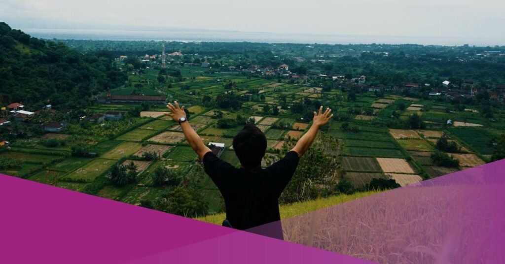 A hiker enjoy the view of his hiking trail in Bali