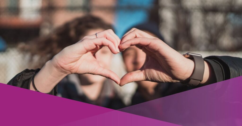 A couple forming heart sign for Valentine's Day