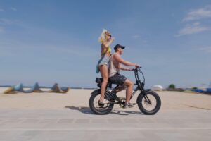 tourist ride e-bike at sanur beach