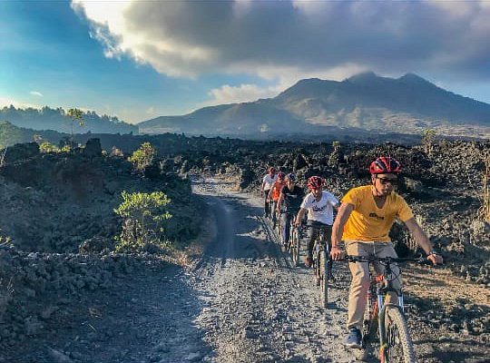 A group of people cycling at Kintamani Highlands