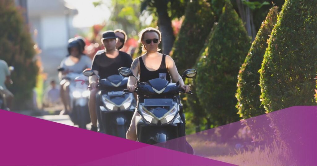 A group of expats riding a motorbike in bali