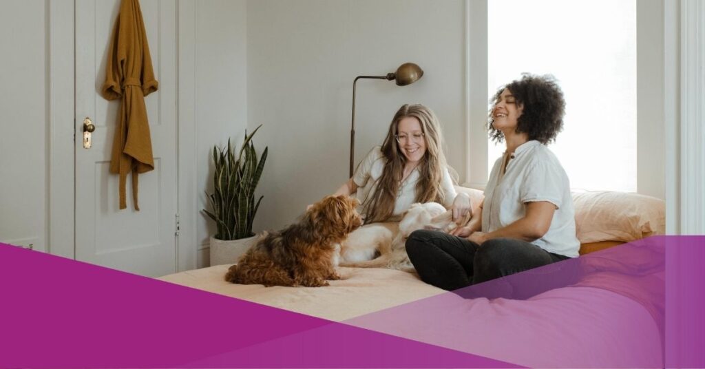 At pet-friendly apartments, a group of friends are playing with their pet.