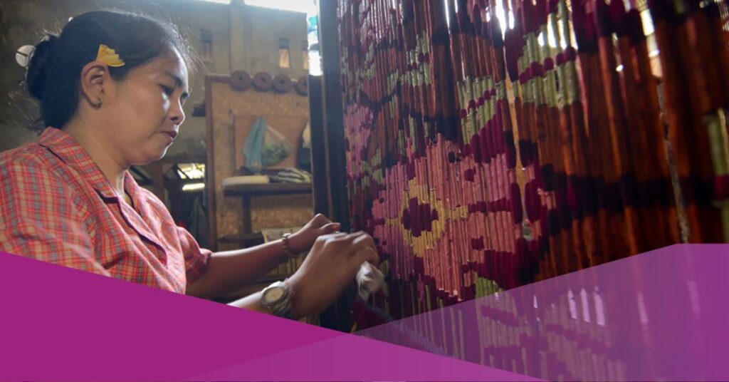 A lady crafts Balinese textile