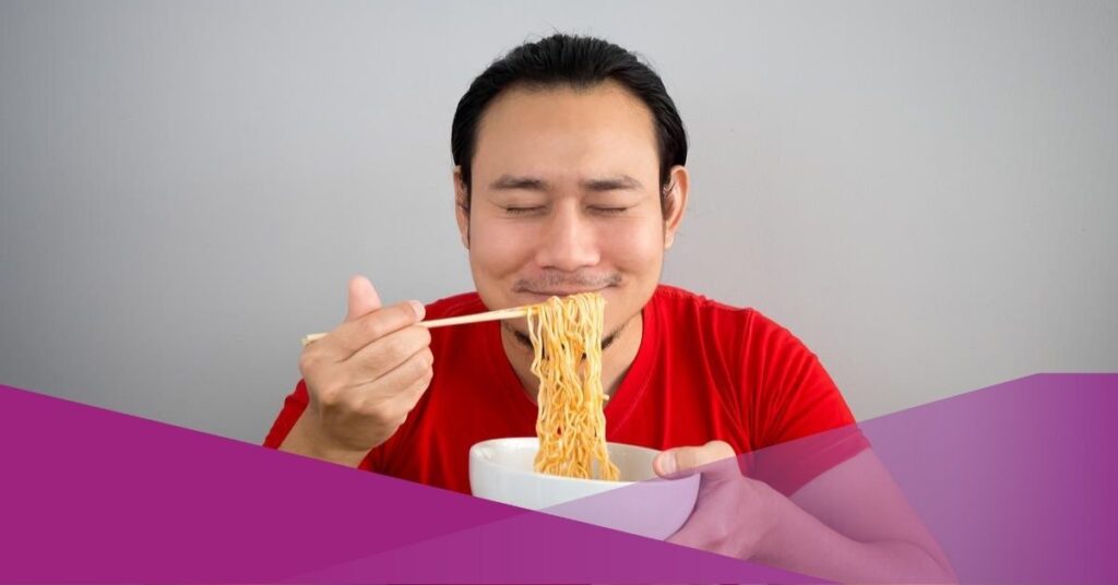 A man enjoying his Indonesian noodles