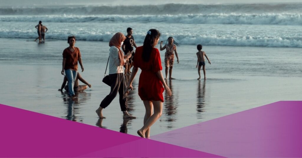 A group of people spend their time in Seminyak Beach, Bali