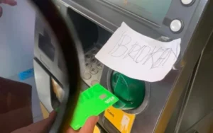 broken sign atm card-skimming scam in bali captured by australian tourist